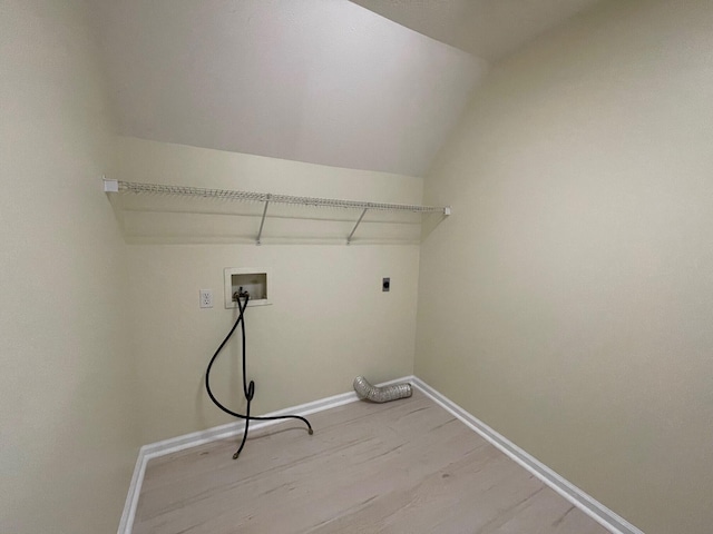 laundry room featuring electric dryer hookup, hardwood / wood-style floors, and washer hookup