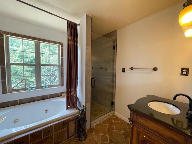 bathroom with plus walk in shower, vanity, and tile patterned floors