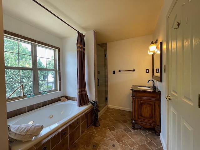 bathroom featuring vanity and plus walk in shower