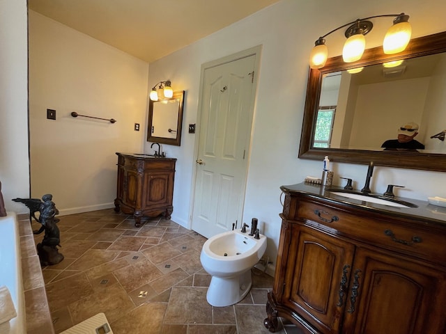 bathroom featuring vanity and a bidet