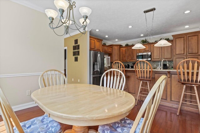 4018 Eagles Nest Dr, Morristown, TN 37813 - dining room featuring a chandelier, recessed lighting, crown molding, dark wood-style floors, and baseboards