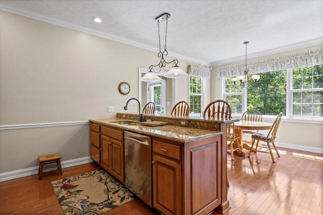 4018 Eagles Nest Dr, Morristown, TN 37813 - kitchen with dishwasher, brown cabinetry, a sink, a peninsula, and hardwood / wood-style flooring