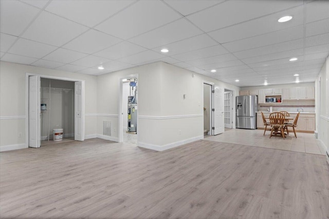 4018 Eagles Nest Dr, Morristown, TN 37813 - living room with a paneled ceiling, light wood-type flooring, water heater, baseboards, and recessed lighting