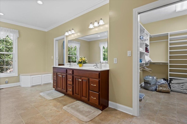 4018 Eagles Nest Dr, Morristown, TN 37813 - bathroom with ornamental molding, baseboards, double vanity, a walk in closet, and tile patterned flooring