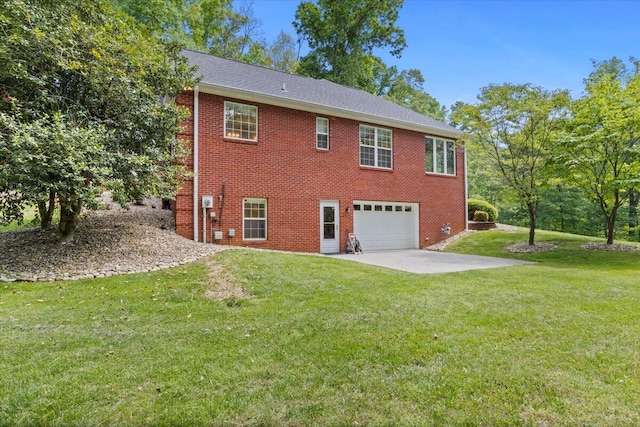 4018 Eagles Nest Dr, Morristown, TN 37813 - rear view of house with a garage, brick siding, and a lawn