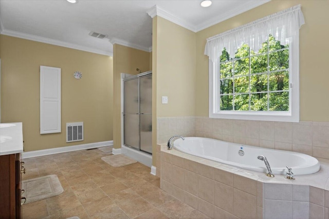 4018 Eagles Nest Dr, Morristown, TN 37813 - bathroom with vanity, a garden tub, a shower stall, crown molding, and baseboards