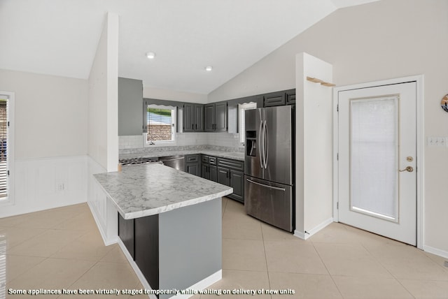 792 Hopper Blf, Rutledge, TN 37861 - kitchen with stainless steel appliances, lofted ceiling, a peninsula, light tile patterned floors, and light countertops