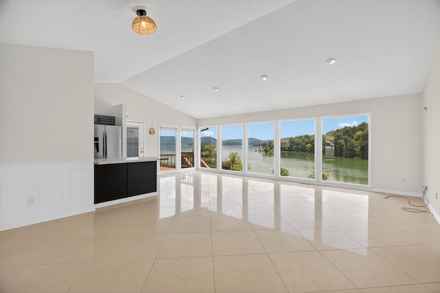 792 Hopper Blf, Rutledge, TN 37861 - empty room with a water view, vaulted ceiling, and light tile patterned floors