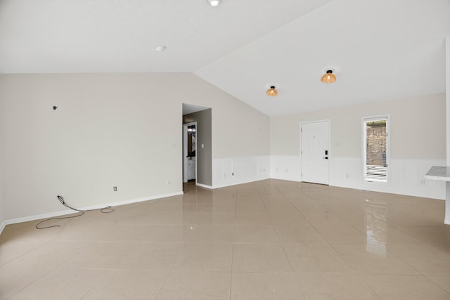 792 Hopper Blf, Rutledge, TN 37861 - empty room featuring vaulted ceiling, a wainscoted wall, and light tile patterned floors