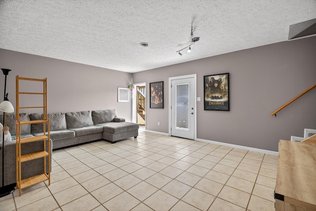 792 Hopper Blf, Rutledge, TN 37861 - living area featuring light tile patterned flooring, a textured ceiling, and stairs