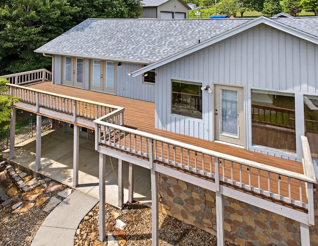 792 Hopper Blf, Rutledge, TN 37861 - view of front of home with a shingled roof, a patio, a wooden deck, and board and batten siding