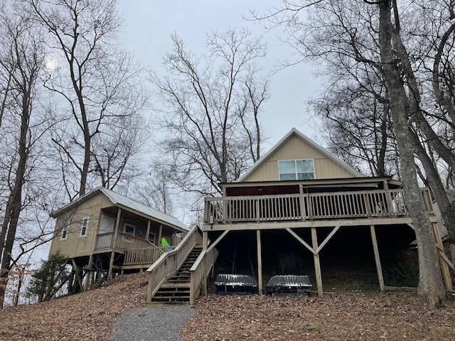 back of property with a wooden deck