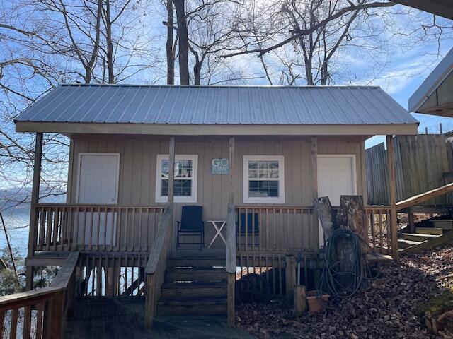 view of outdoor structure featuring covered porch