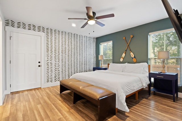 855 Blue Herring Way, Sevierville, TN 37876 - bedroom featuring an accent wall, wallpapered walls, light wood-type flooring, recessed lighting, and ceiling fan