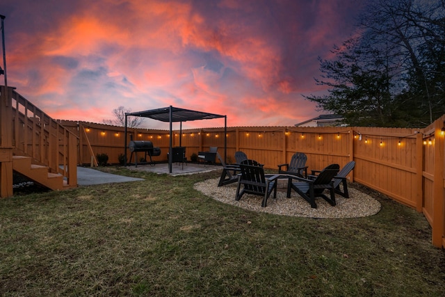 855 Blue Herring Way, Sevierville, TN 37876 - yard at dusk with a patio area