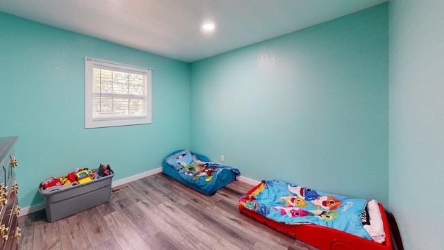 bedroom with light hardwood / wood-style flooring