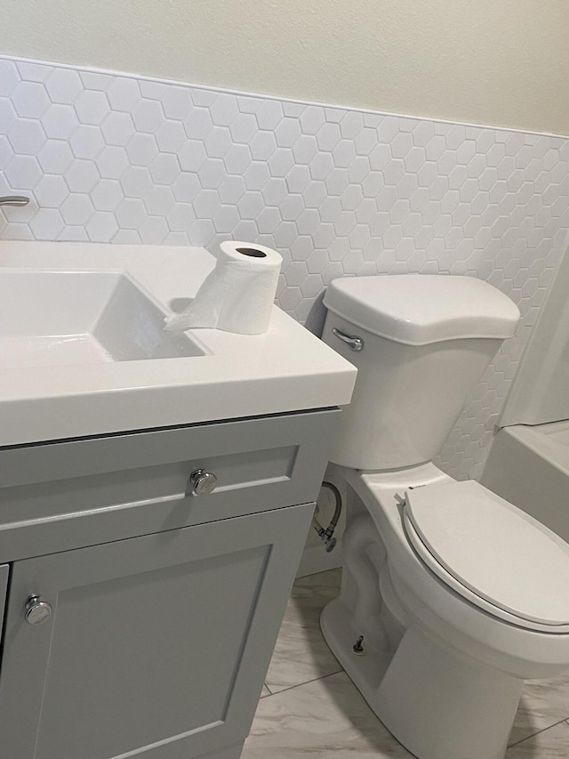 bathroom with vanity and toilet