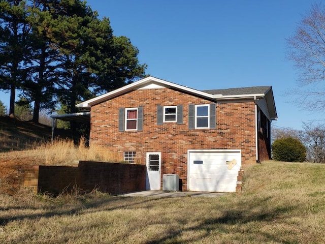 back of property with a garage