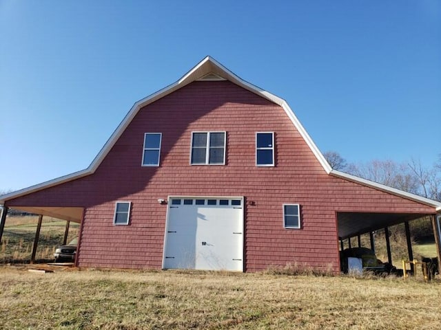 view of side of property featuring an outbuilding