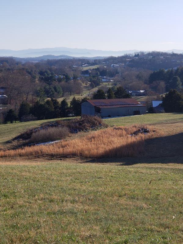 view of mountain feature with a rural view