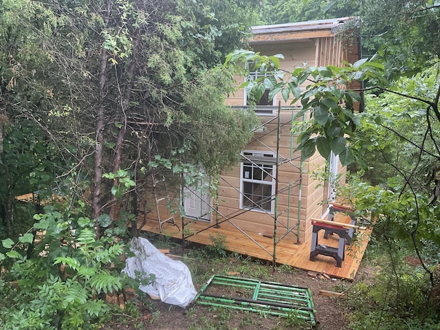 view of home's exterior featuring a wooden deck