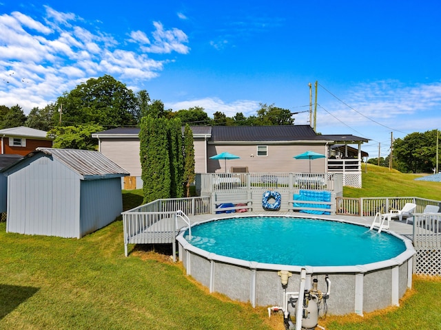 1438 Shannons Little Mtn Rd, Morristown, TN 37814 - swimming pool featuring a wooden deck, a lawn, and a storage unit
