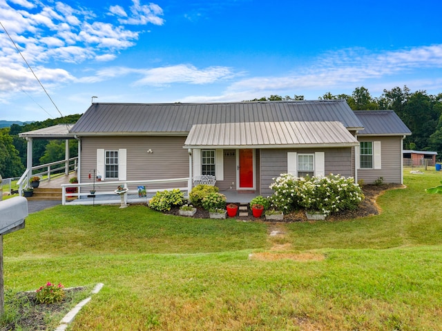 1438 Shannons Little Mtn Rd, Morristown, TN 37814 - view of front of property featuring a porch, a front yard, and a metal roof