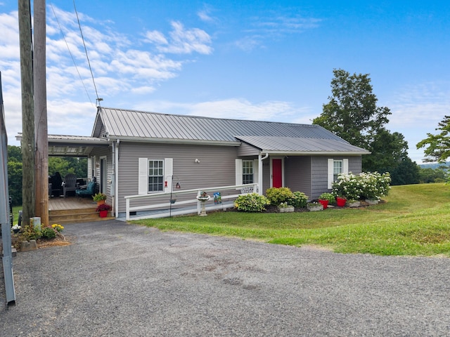 1438 Shannons Little Mtn Rd, Morristown, TN 37814 - view of front facade featuring a metal roof, a front lawn, a carport, and a wooden deck