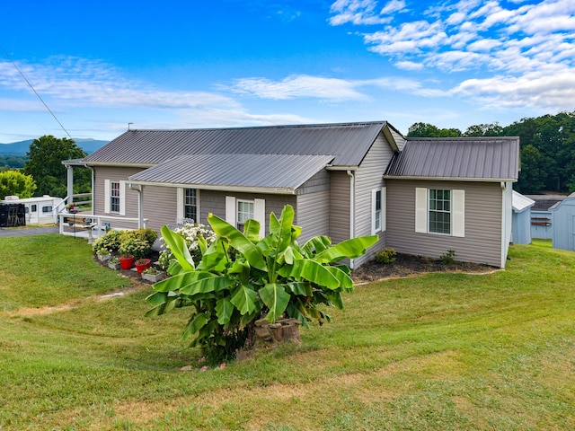 1438 Shannons Little Mtn Rd, Morristown, TN 37814 - view of front of home with a metal roof and a front yard