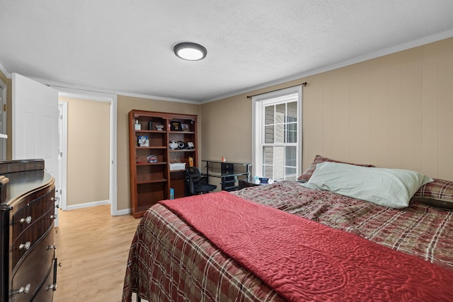 1438 Shannons Little Mtn Rd, Morristown, TN 37814 - bedroom featuring light wood finished floors, a textured ceiling, and ornamental molding