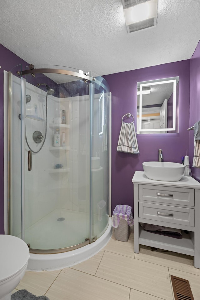 1438 Shannons Little Mtn Rd, Morristown, TN 37814 - bathroom with vanity, a shower stall, and a textured ceiling