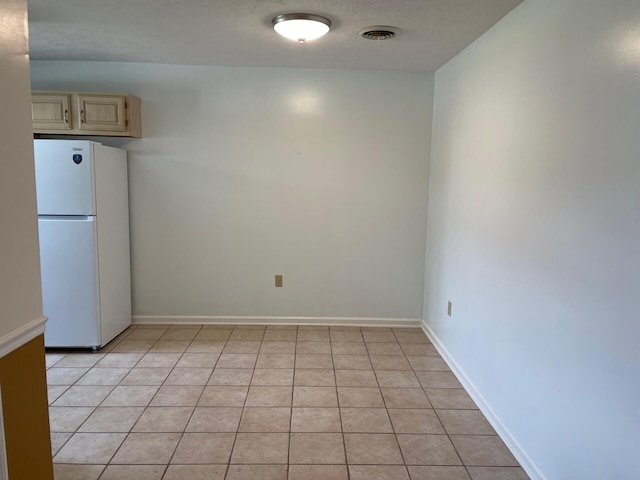 1412 Secreretariat Dr, Morristown, TN 37814 - empty room featuring light tile patterned floors and baseboards