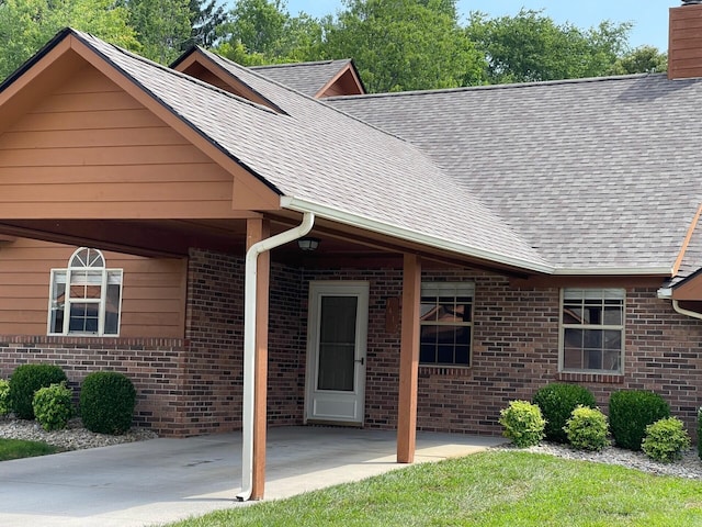 1412 Secreretariat Dr, Morristown, TN 37814 - view of front of property with brick siding, roof with shingles, and a chimney