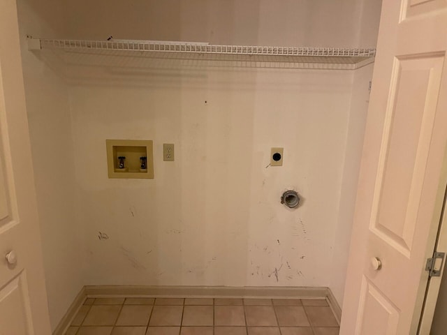 1412 Secreretariat Dr, Morristown, TN 37814 - clothes washing area featuring electric dryer hookup, light tile patterned flooring, baseboards, and washer hookup
