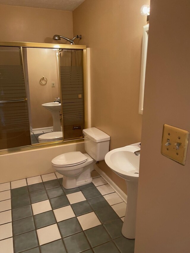 1412 Secreretariat Dr, Morristown, TN 37814 - bathroom with enclosed tub / shower combo, toilet, and tile patterned floors
