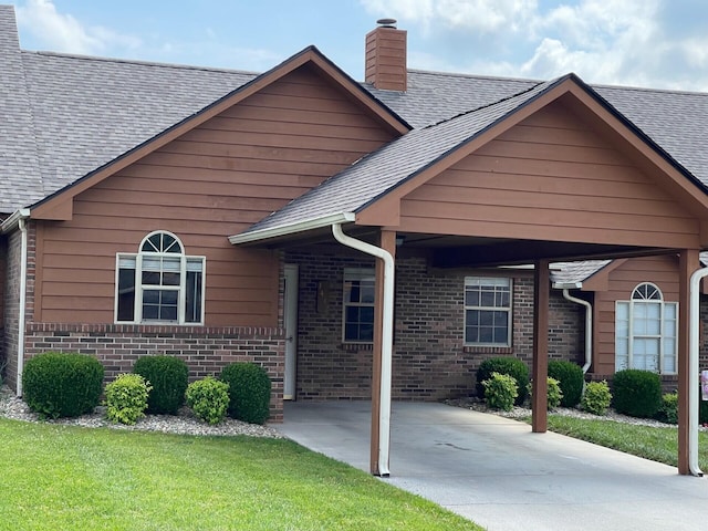 1412 Secreretariat Dr, Morristown, TN 37814 - view of front of house featuring brick siding, a chimney, and roof with shingles
