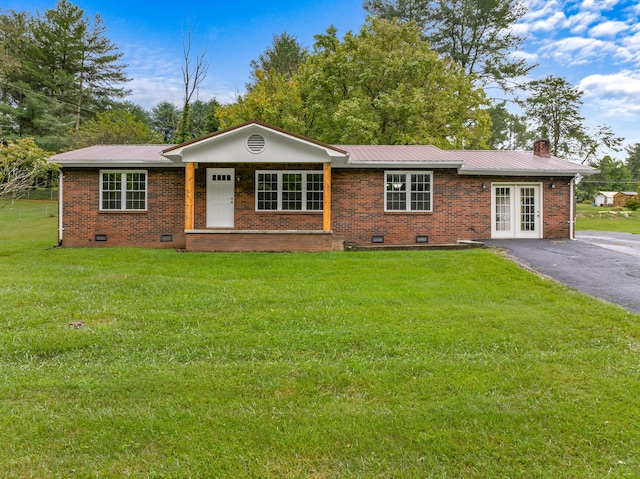 single story home with driveway, a front lawn, crawl space, and brick siding