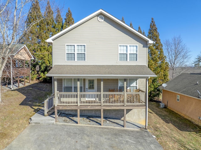 view of front of property with a porch and cooling unit