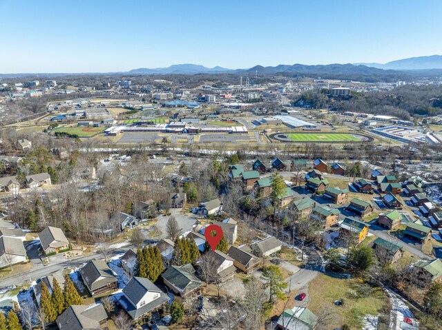 birds eye view of property with a mountain view