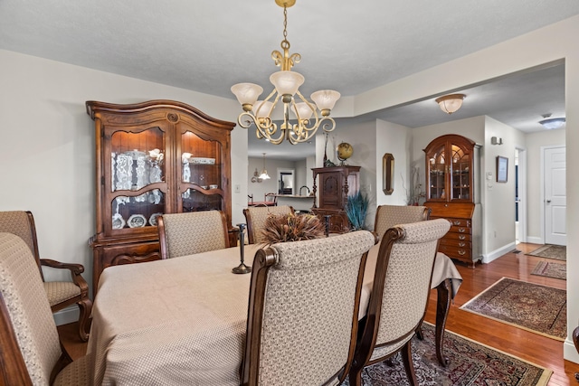 5704 Long Creek Rd, Morristown, TN 37813 - dining space featuring a chandelier and wood finished floors