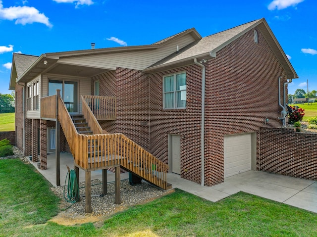 5704 Long Creek Rd, Morristown, TN 37813 - rear view of property featuring stairs, brick siding, a garage, a yard, and concrete driveway