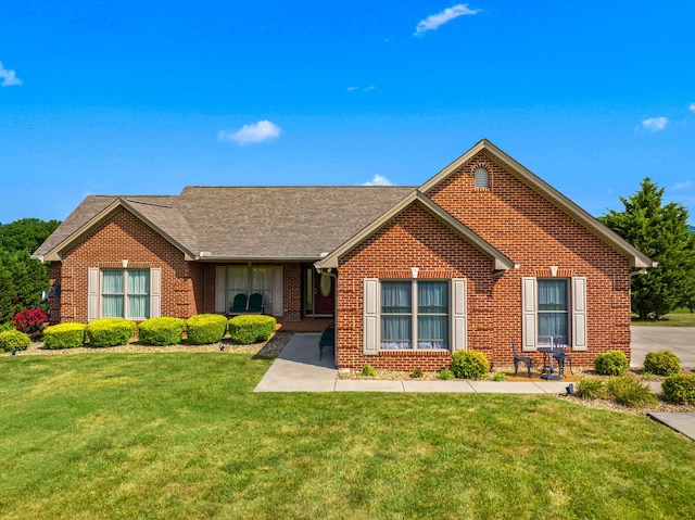 5704 Long Creek Rd, Morristown, TN 37813 - ranch-style house featuring a front yard, brick siding, and roof with shingles
