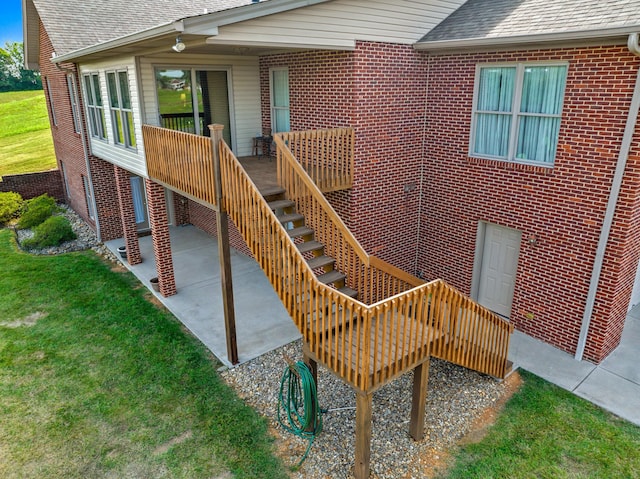 5704 Long Creek Rd, Morristown, TN 37813 - property entrance featuring a shingled roof, brick siding, a lawn, and a patio