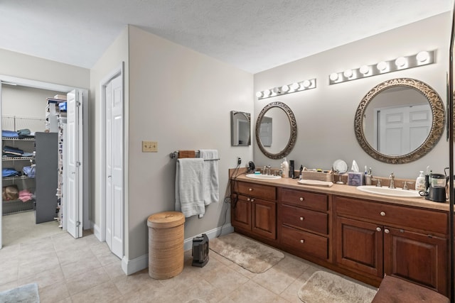 5704 Long Creek Rd, Morristown, TN 37813 - bathroom featuring double vanity, a walk in closet, and tile patterned flooring