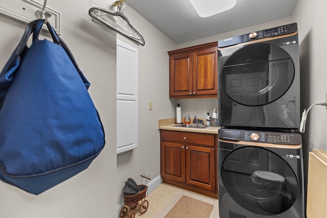 5704 Long Creek Rd, Morristown, TN 37813 - laundry room featuring stacked washing machine and dryer and cabinet space