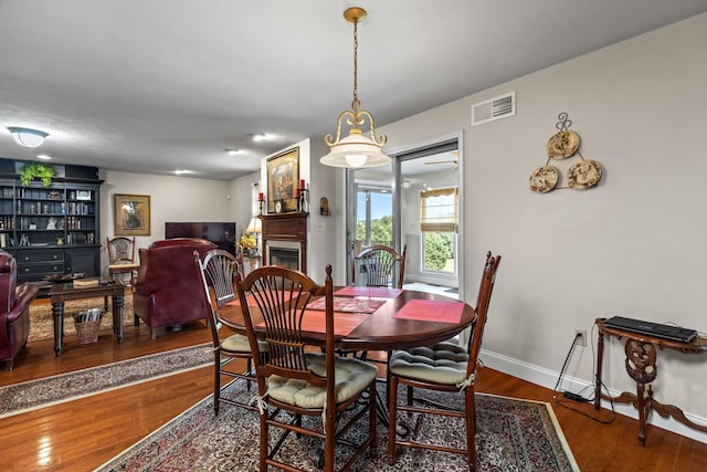5704 Long Creek Rd, Morristown, TN 37813 - dining space with wood finished floors and a fireplace