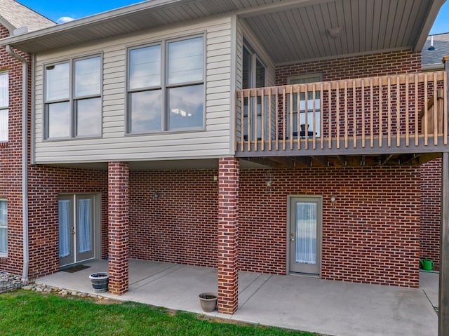 5704 Long Creek Rd, Morristown, TN 37813 - view of property exterior featuring a balcony, a patio, and brick siding