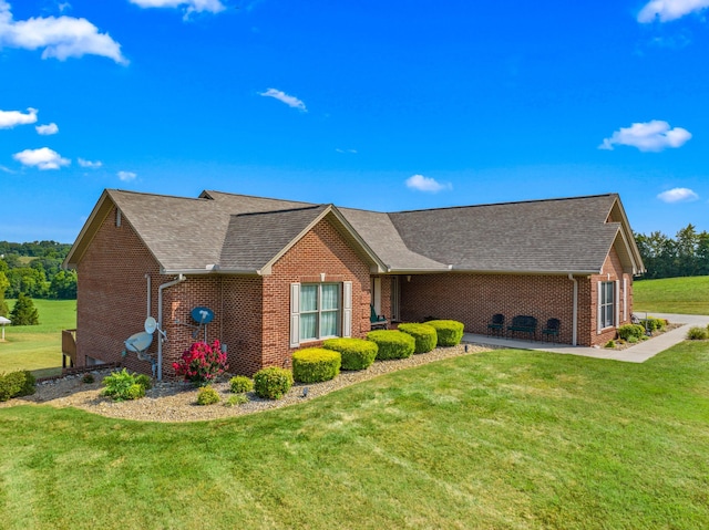 5704 Long Creek Rd, Morristown, TN 37813 - view of front facade featuring brick siding, a front lawn, and roof with shingles
