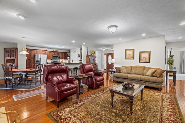 5704 Long Creek Rd, Morristown, TN 37813 - living area featuring dark wood-style flooring, recessed lighting, and a textured ceiling