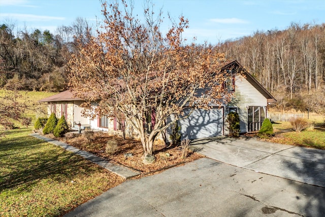 view of side of home with a garage